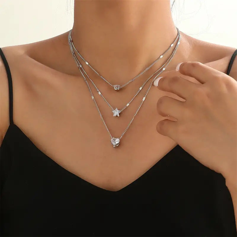 Collier Céleste Argenté — Cœur, Étoile & Goutte de Lumière